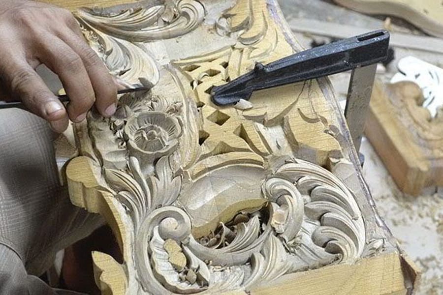 Carving the baroque console table front side